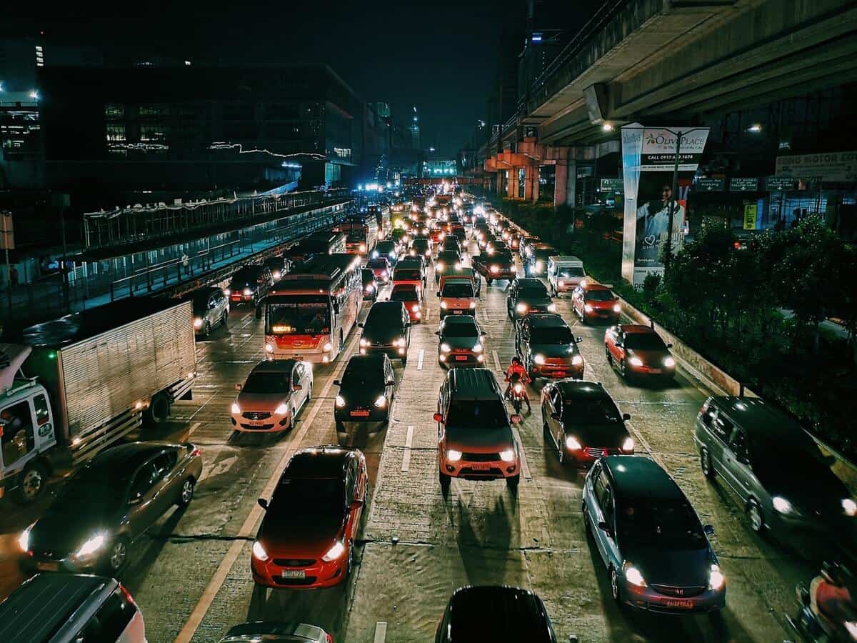 A traffic jam on a highway at night in a city.