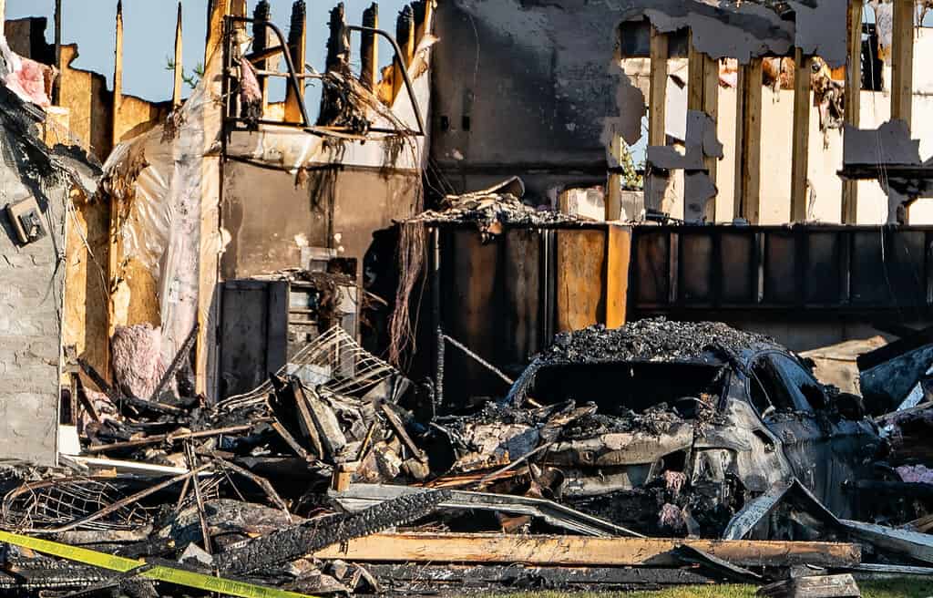 The aftermath of a home that has undergone extensive fire damage.