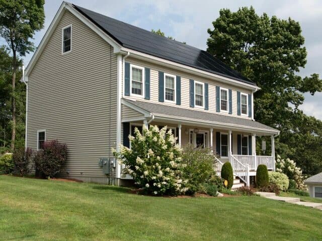 house with 5 windows full roof of solar panels