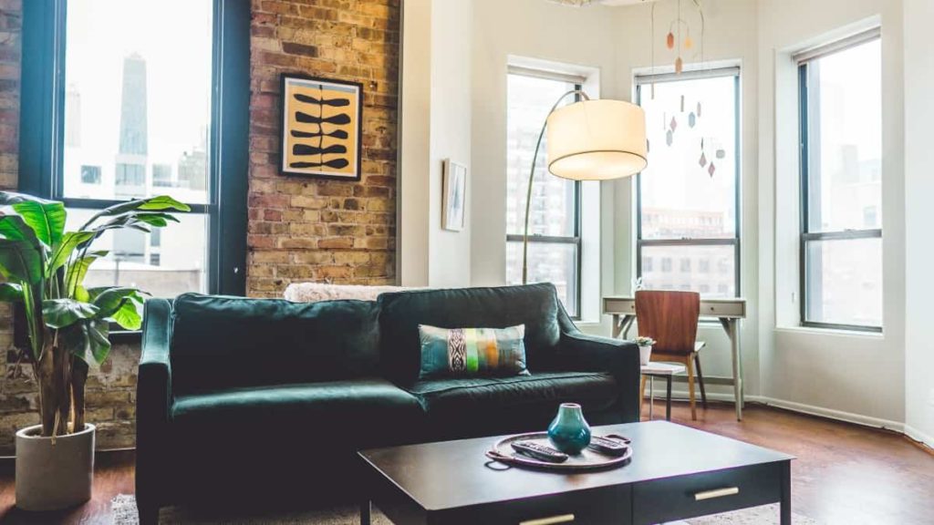 An apartment's living area with contemporary furniture and decorations.