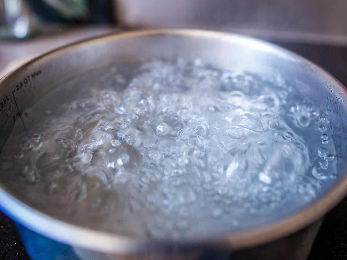 boiling water in a metal pot