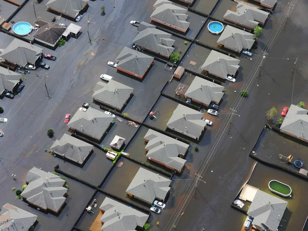 aerial image of multiple houses that are flooded