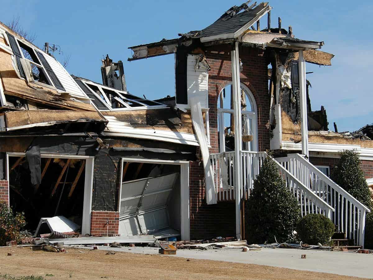 remaining wreckage of a damaged house from a fire