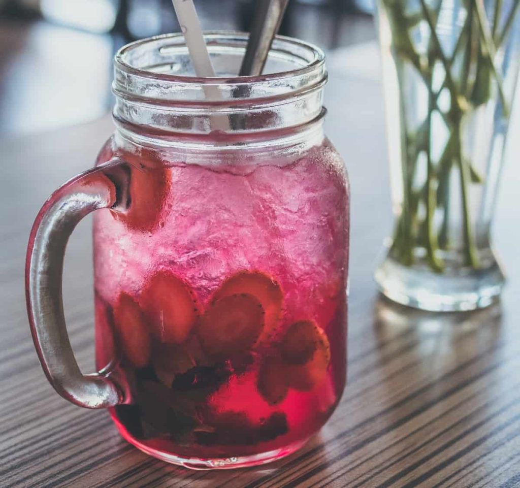 fruit infused water in a ball jar glass