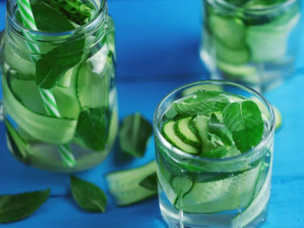 mint, cucumber infused water in three glasses