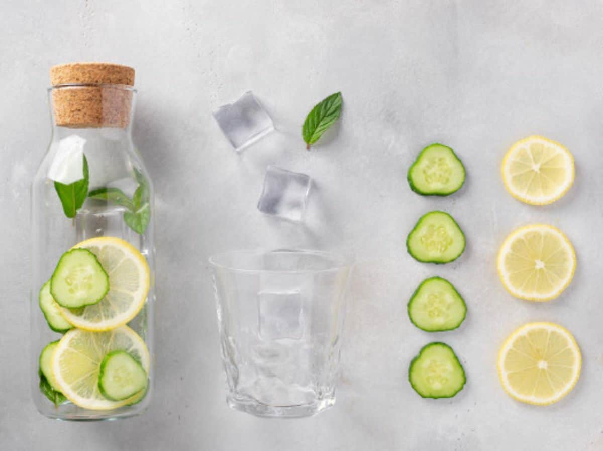 cucumber, lemon, ice, and water, with the pitcher on the very left