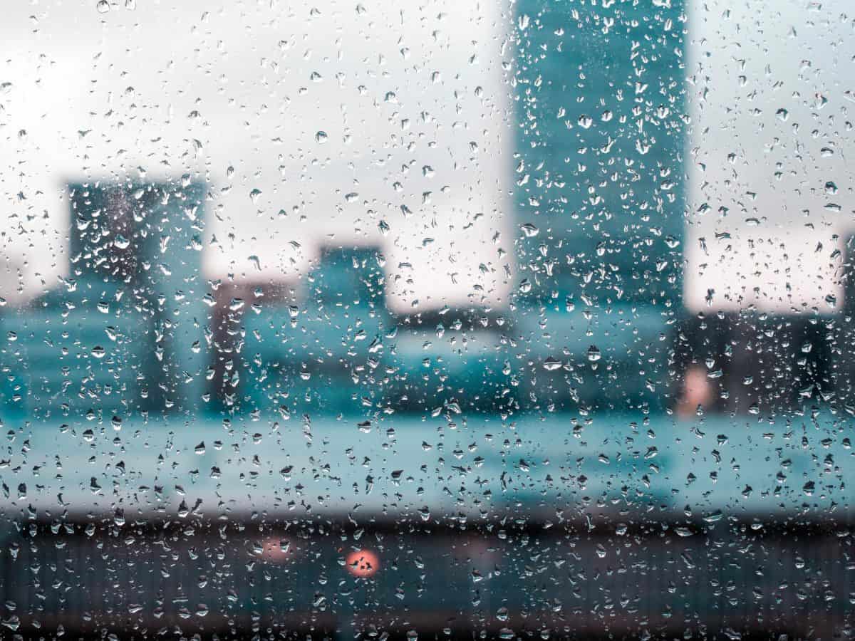 rainy day, rain on window facing buildings