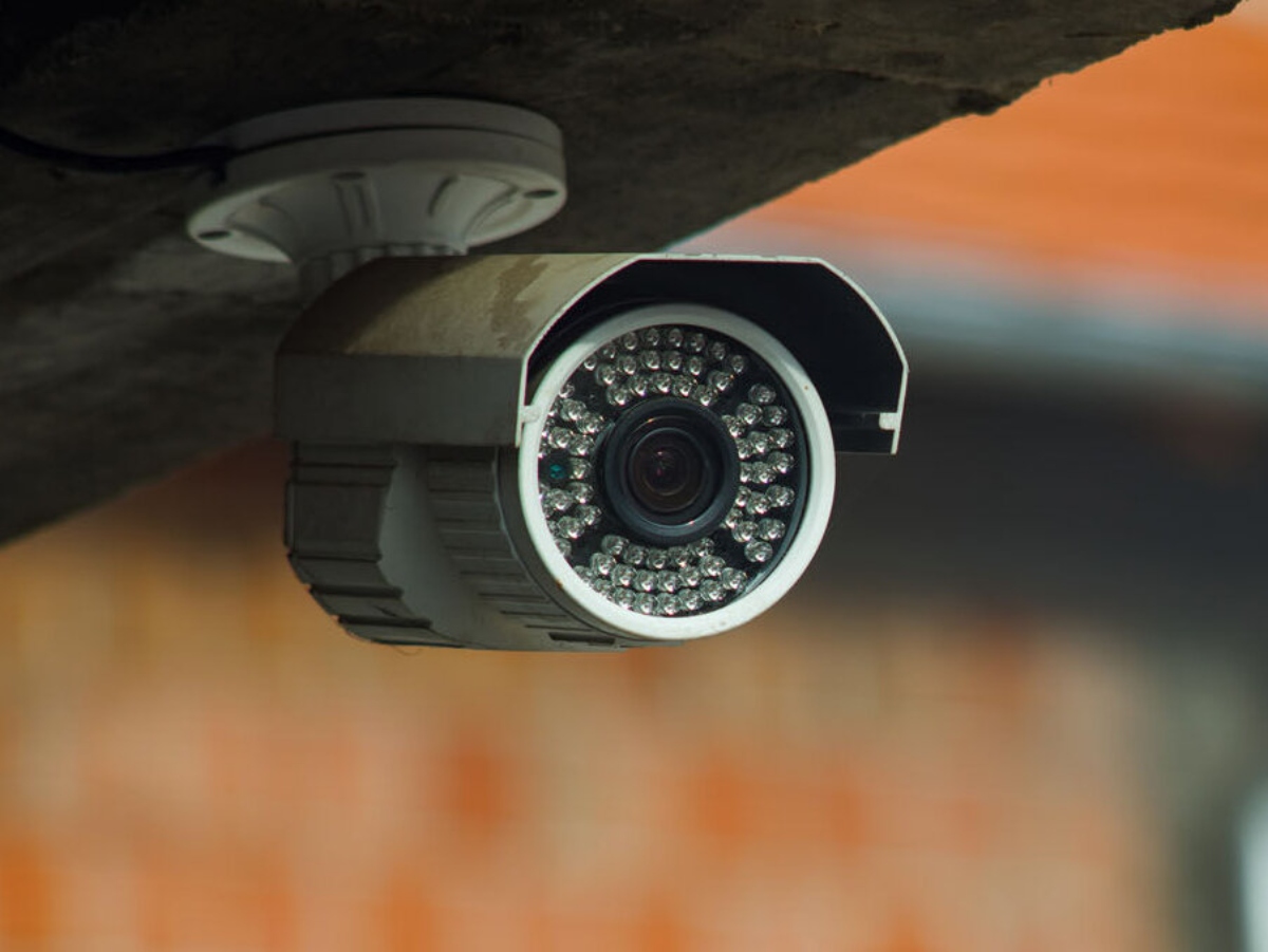 Surveillance security camera under the concrete wall of the building