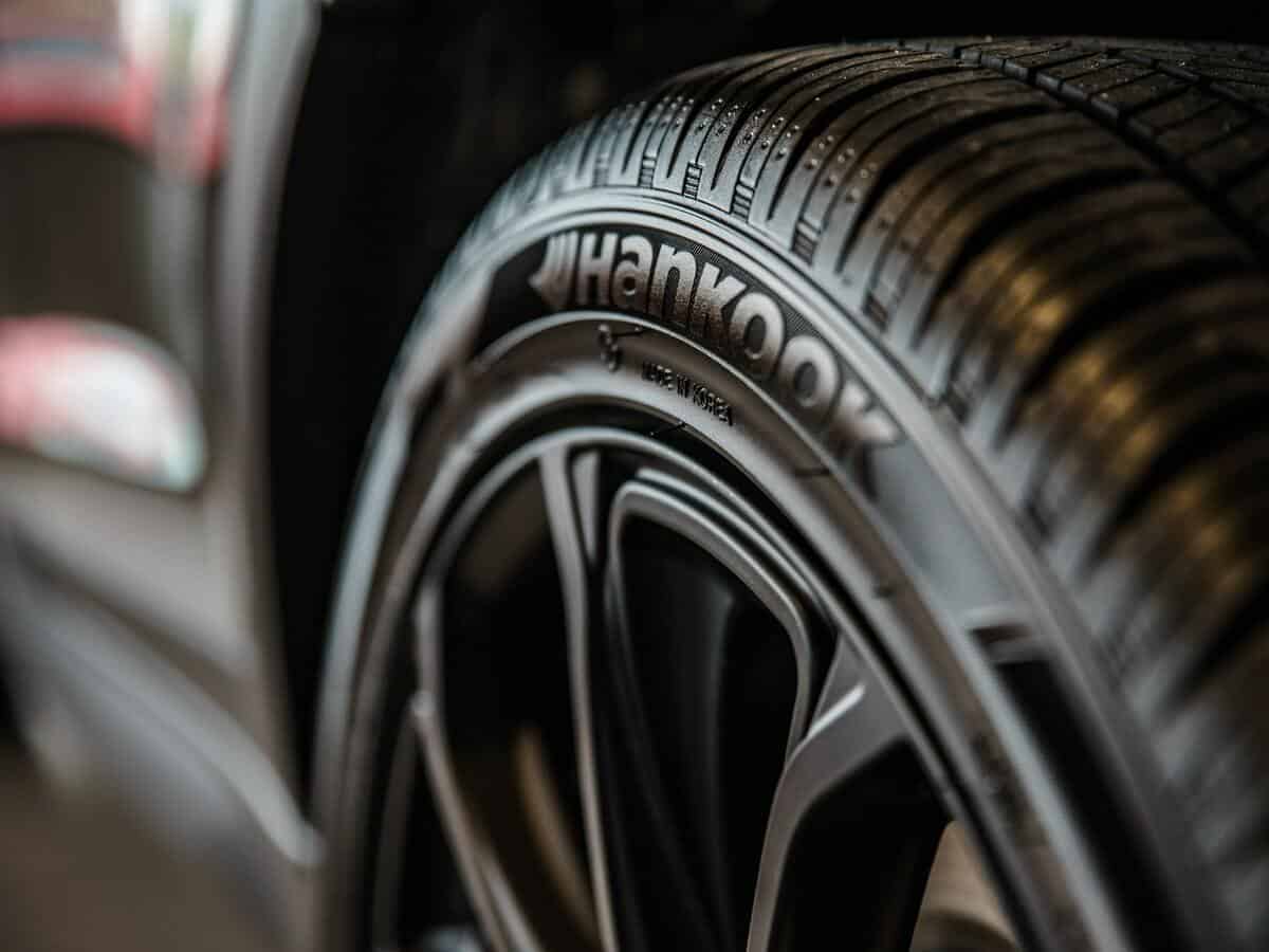 Close-up of shiny black tires on a vehicle.