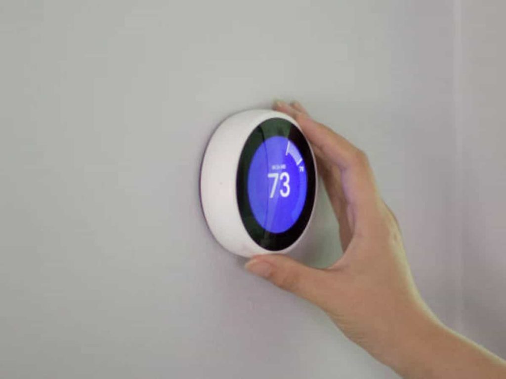 nest smart thermostat showing 73 degrees