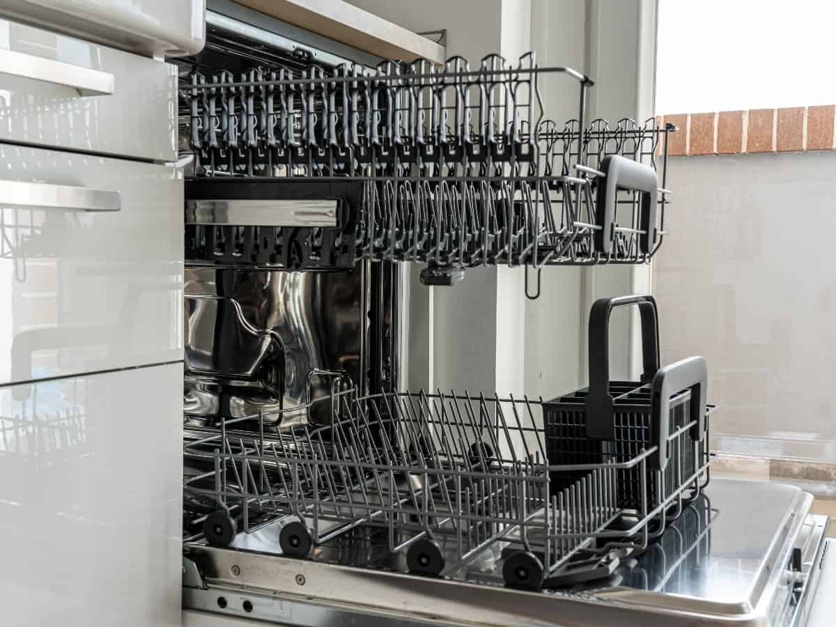 view of an open and empty dishwasher appliance