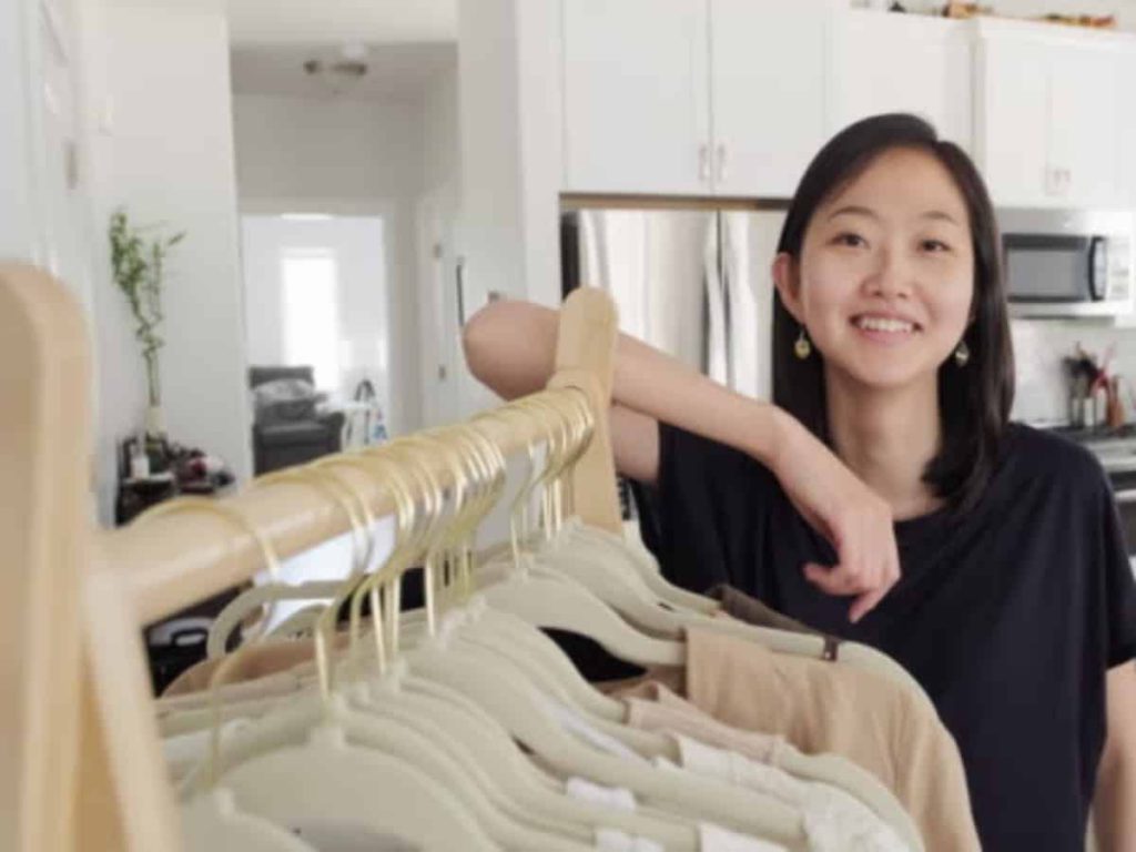 Woman working for clothes in a home boutique