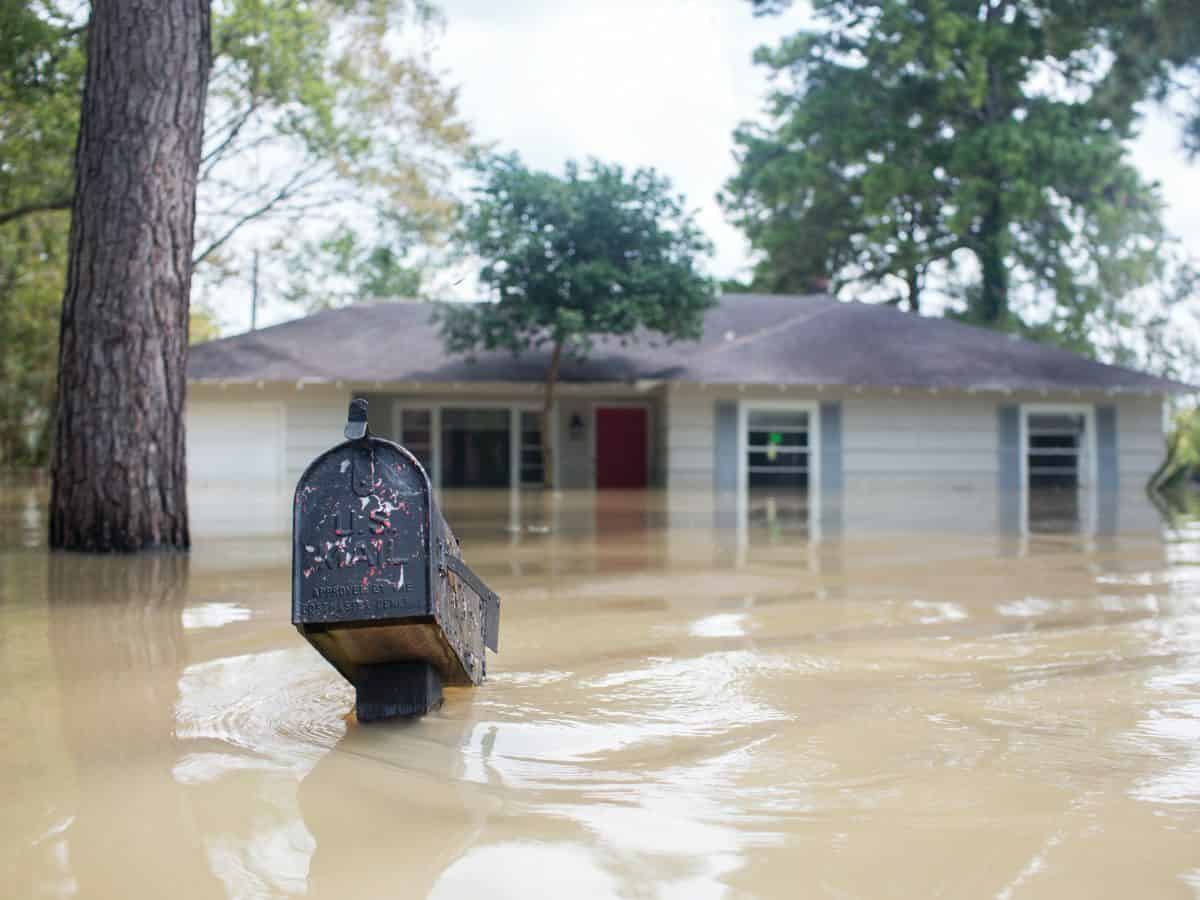 hurricane harvey flooded neighborhood with house and mailbox flooded
