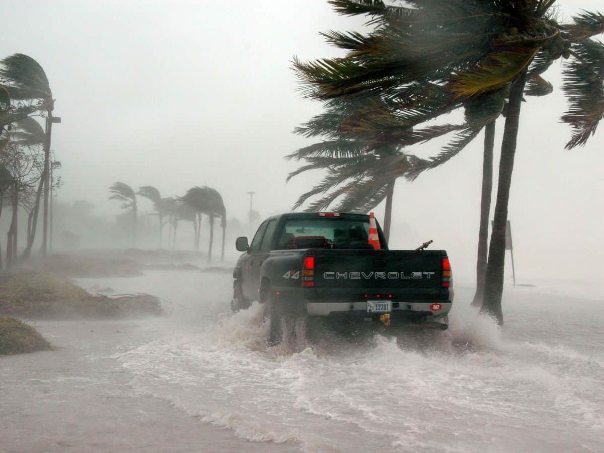 truck driving through flooded key west street