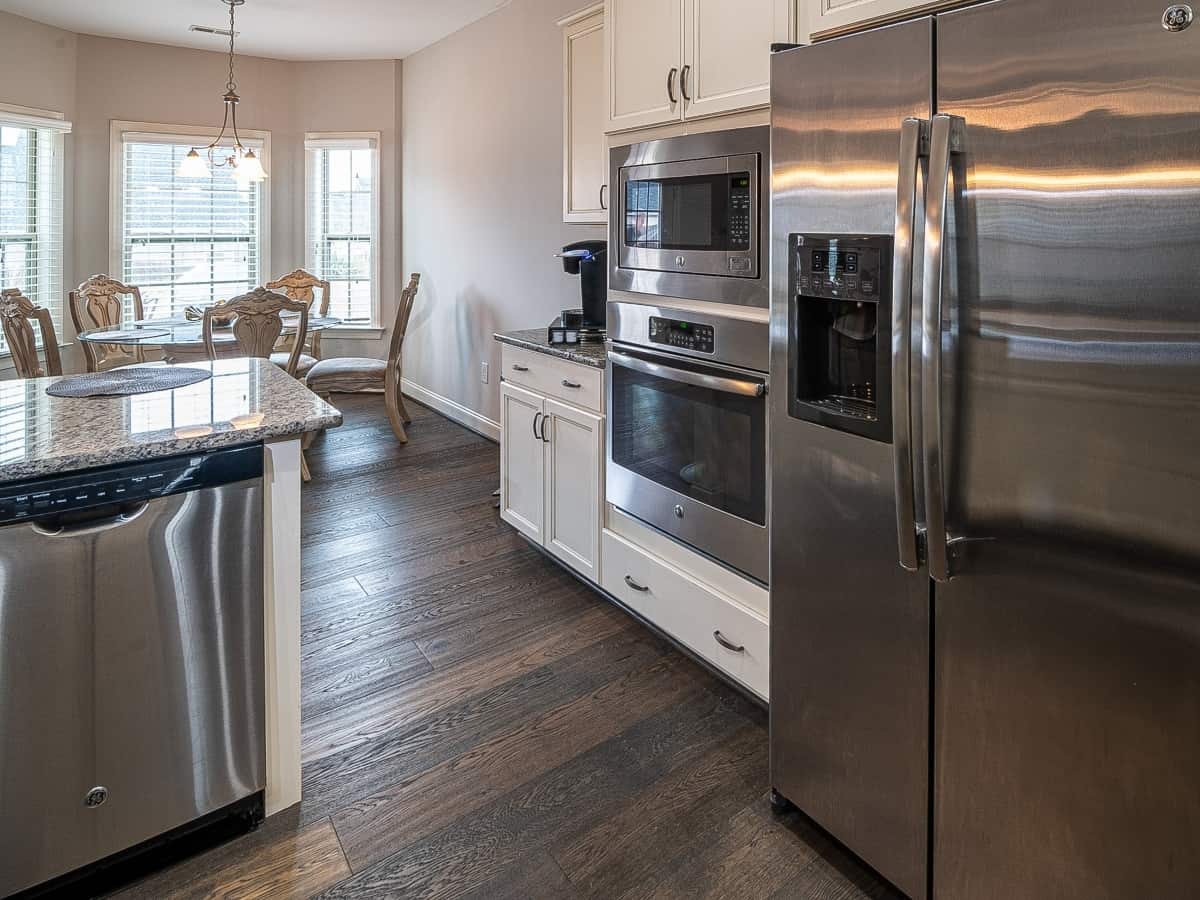 view of a kitchen with the fridge, oven and dishwasher