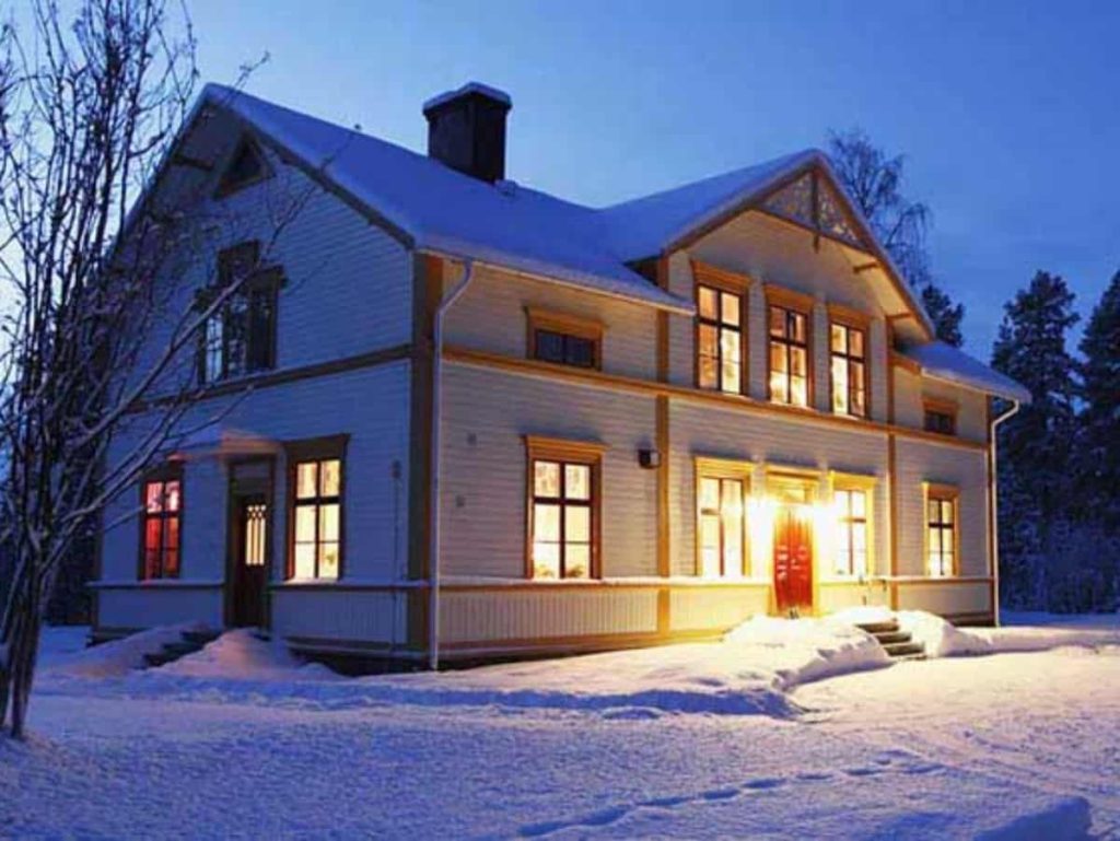 home during winter that is internally lit up