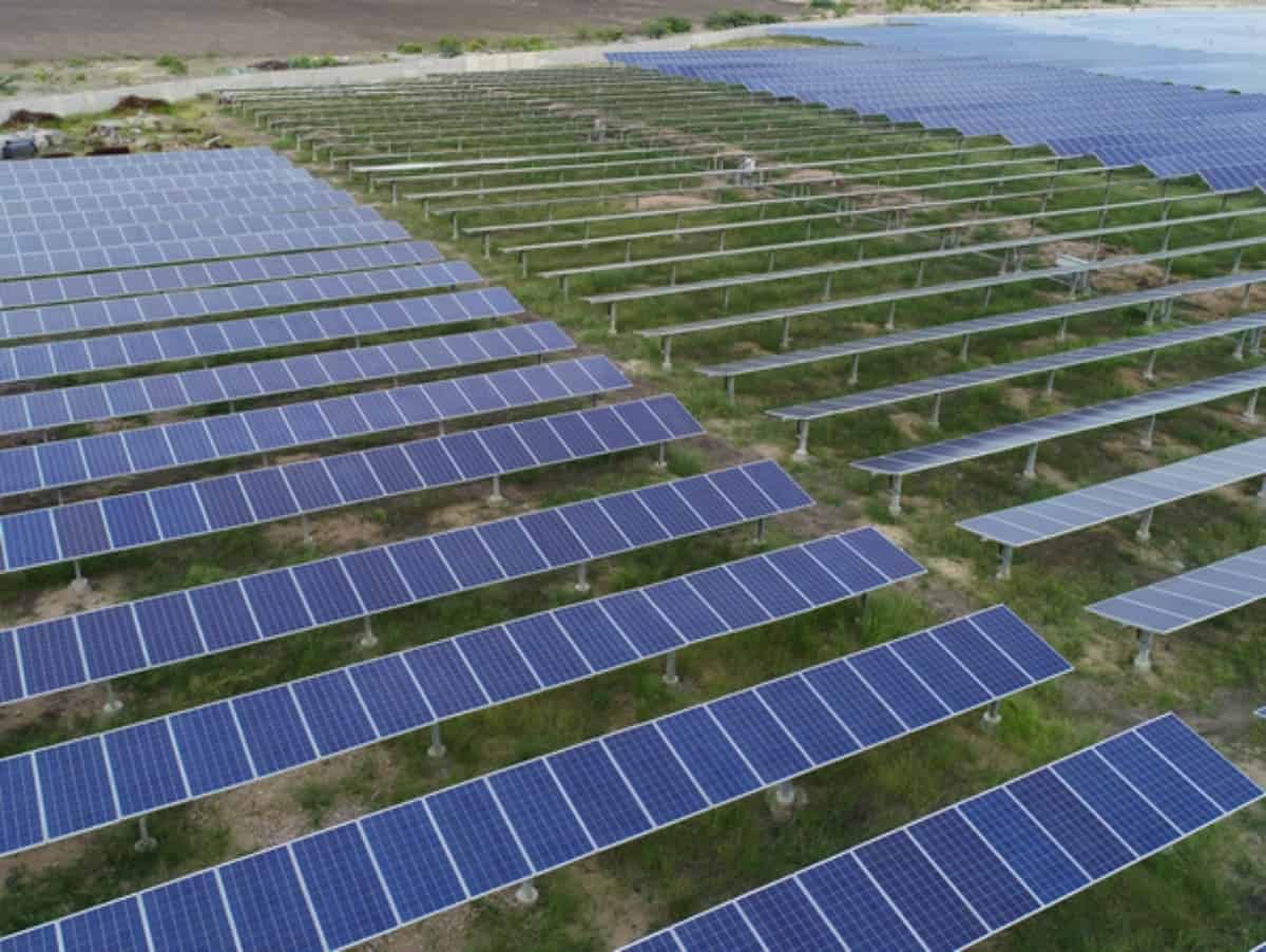 aerial view of a solar power plant with three rows