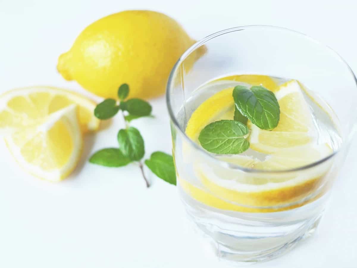 lemon and mint infused water in a clear glass