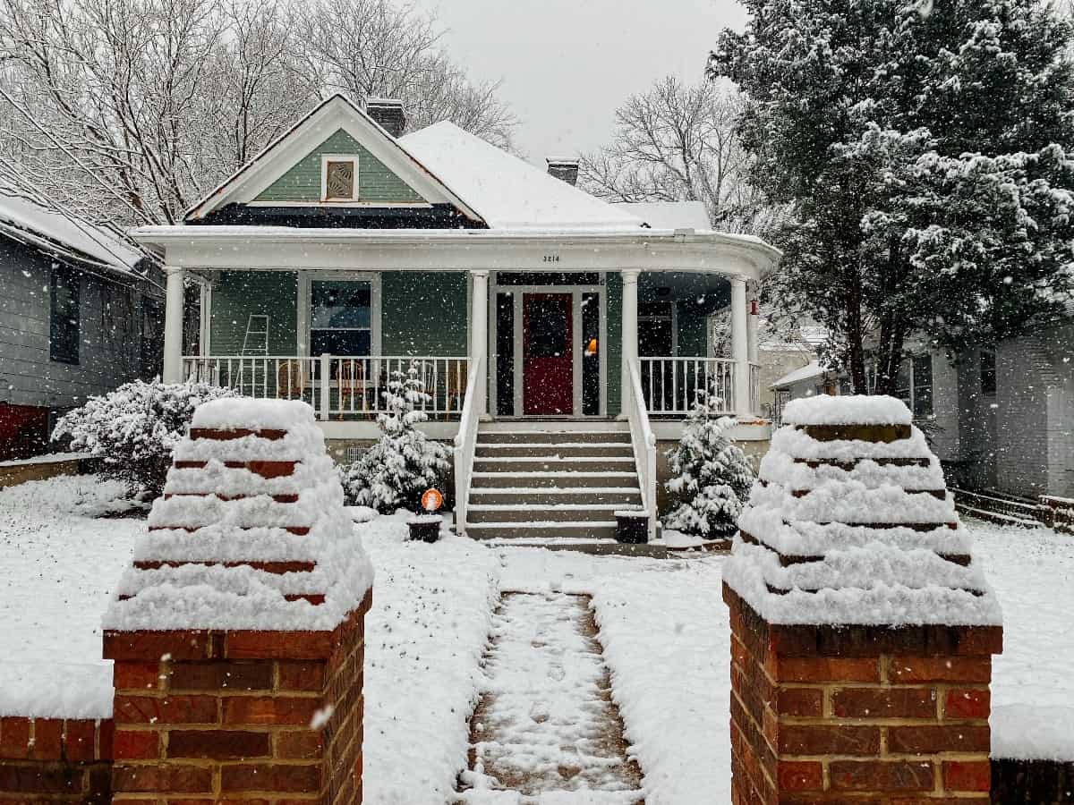 sidewalk view of a house during cold weather