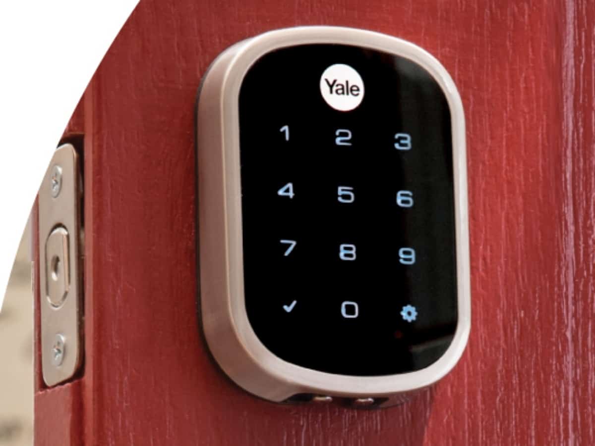 yale smart lock on an oak front door