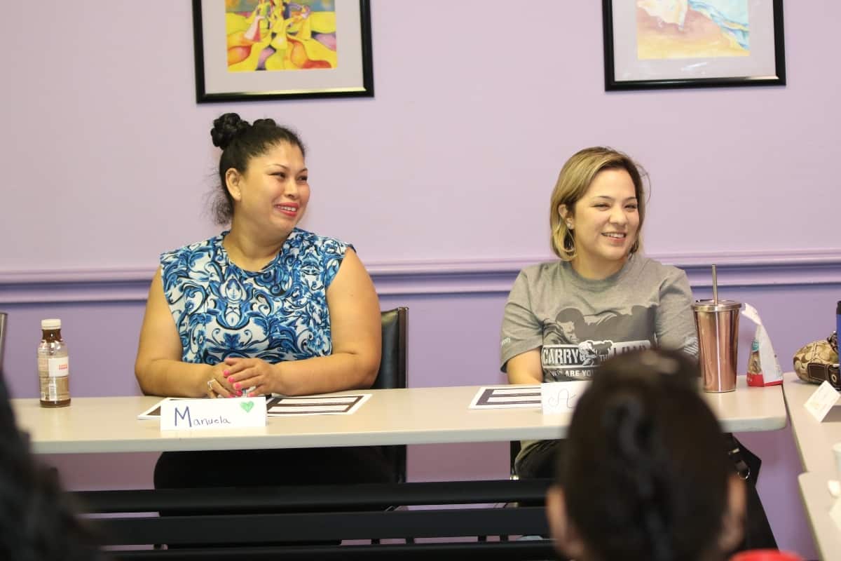 Attitudes and Attire participants sit in the organization's classroom.