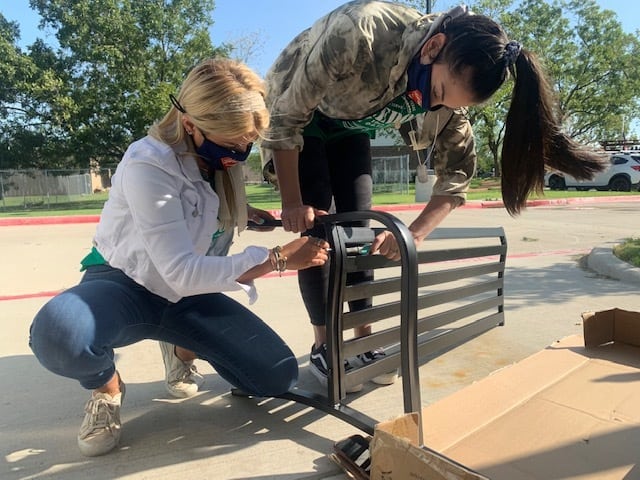 Two Patriot PAWS volunteers work outside on a task.
