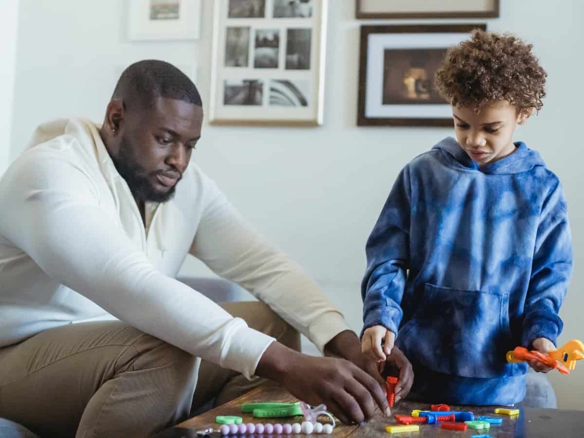 teaching a kid through toys and activities father and son