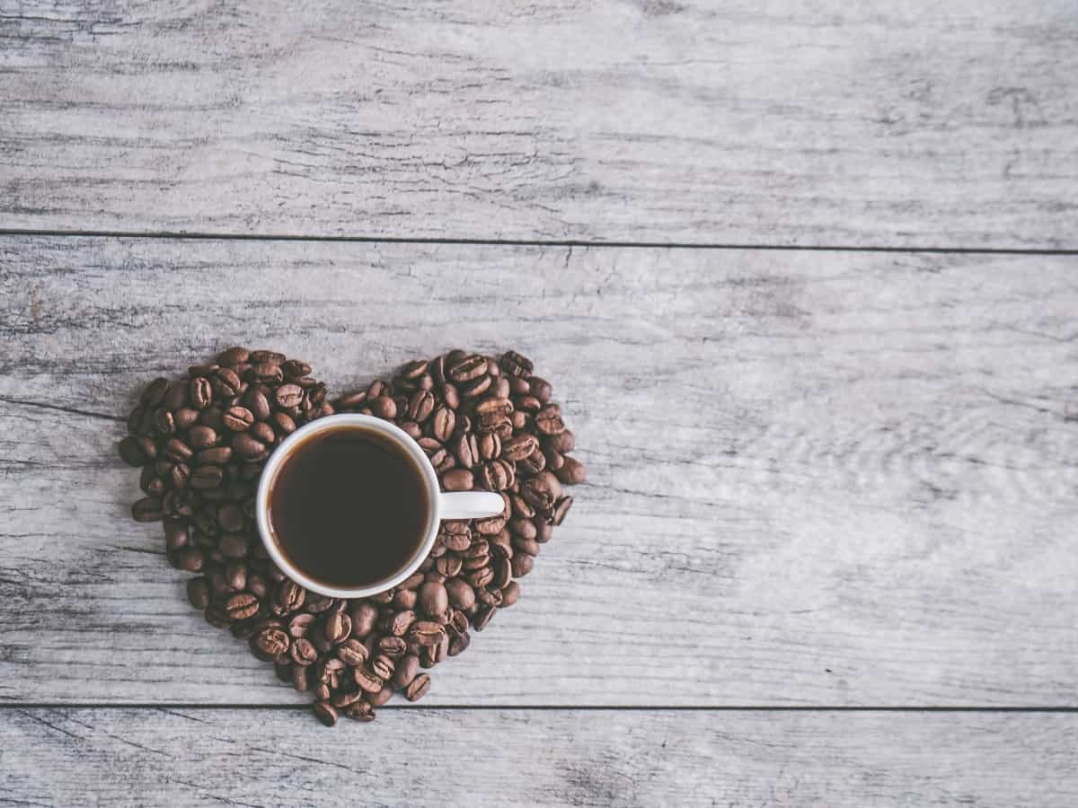 coffee beans in a heart around a coffee mug for couples coffee co, a dallas small business owned by a veteran