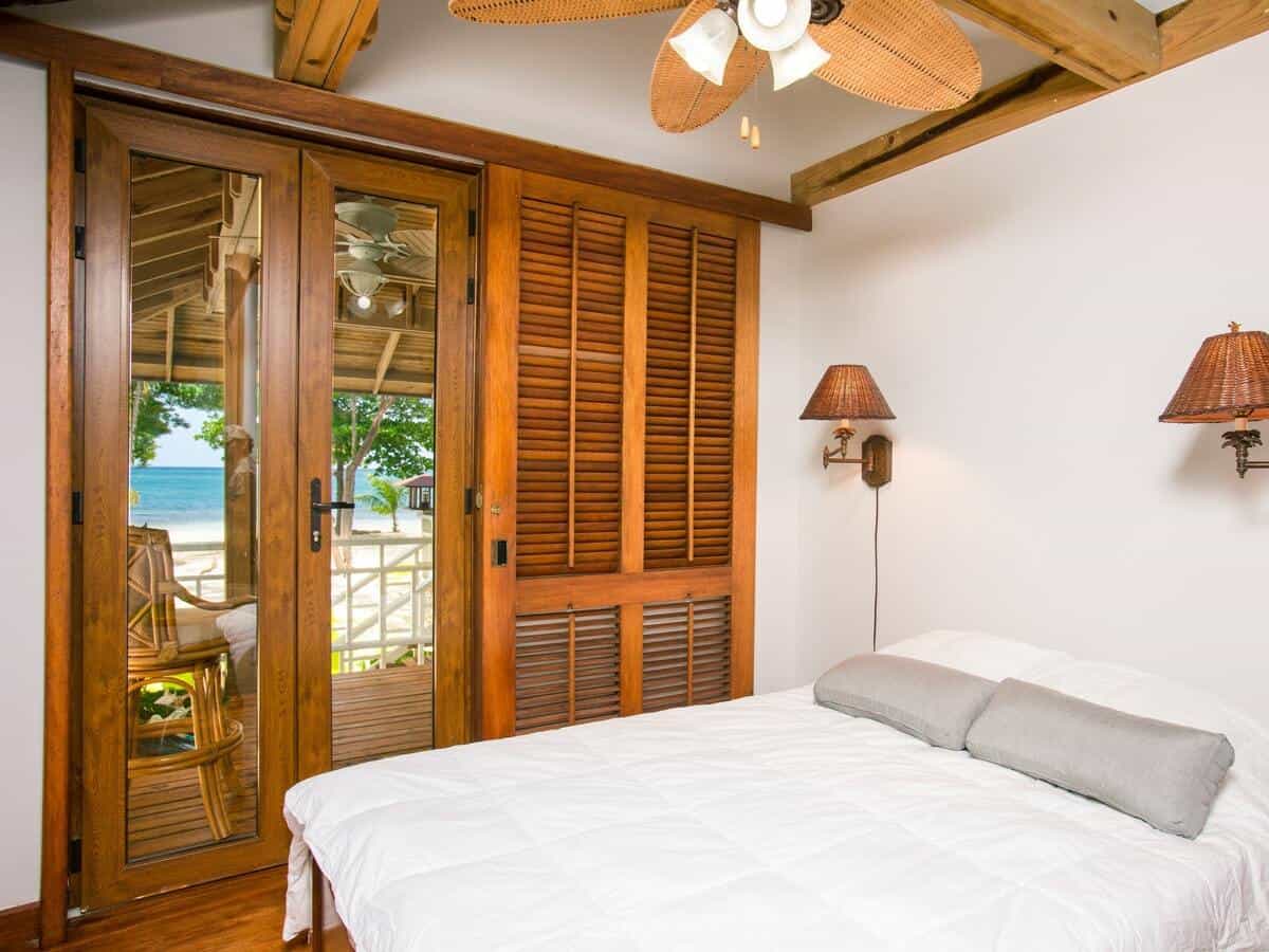 Brown hurricane shutters installed in a bedroom.