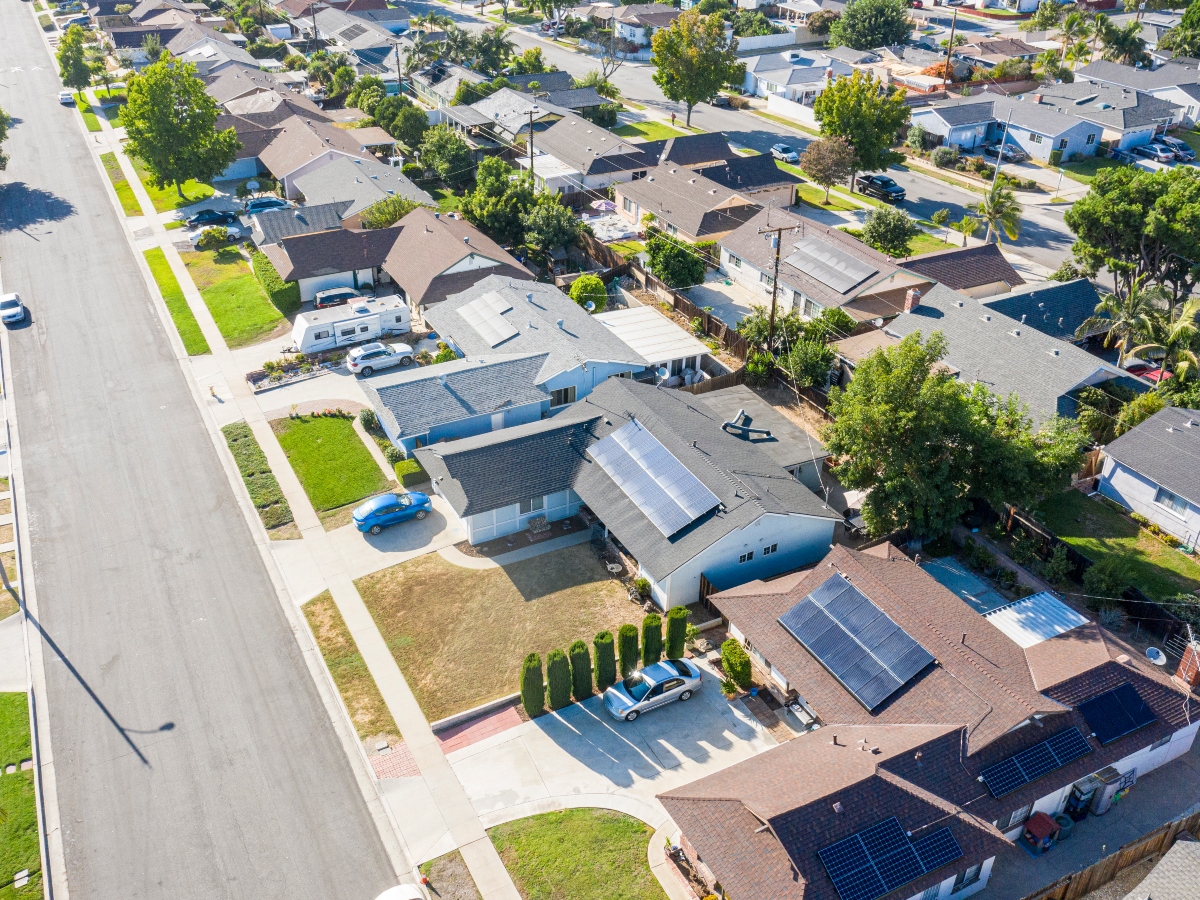 solar panels on a group of houses in a neighborhood