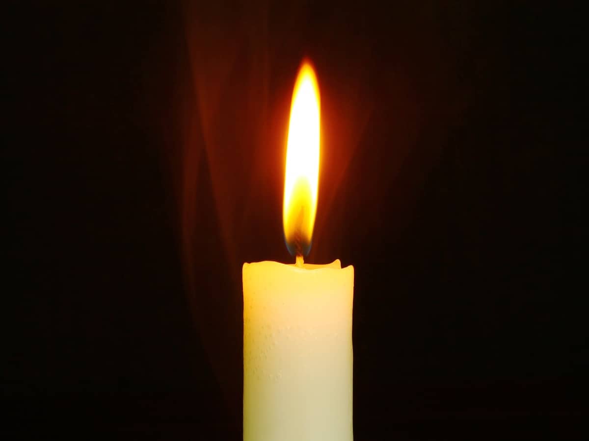 a close up image of a flame in a candle holder to create heat