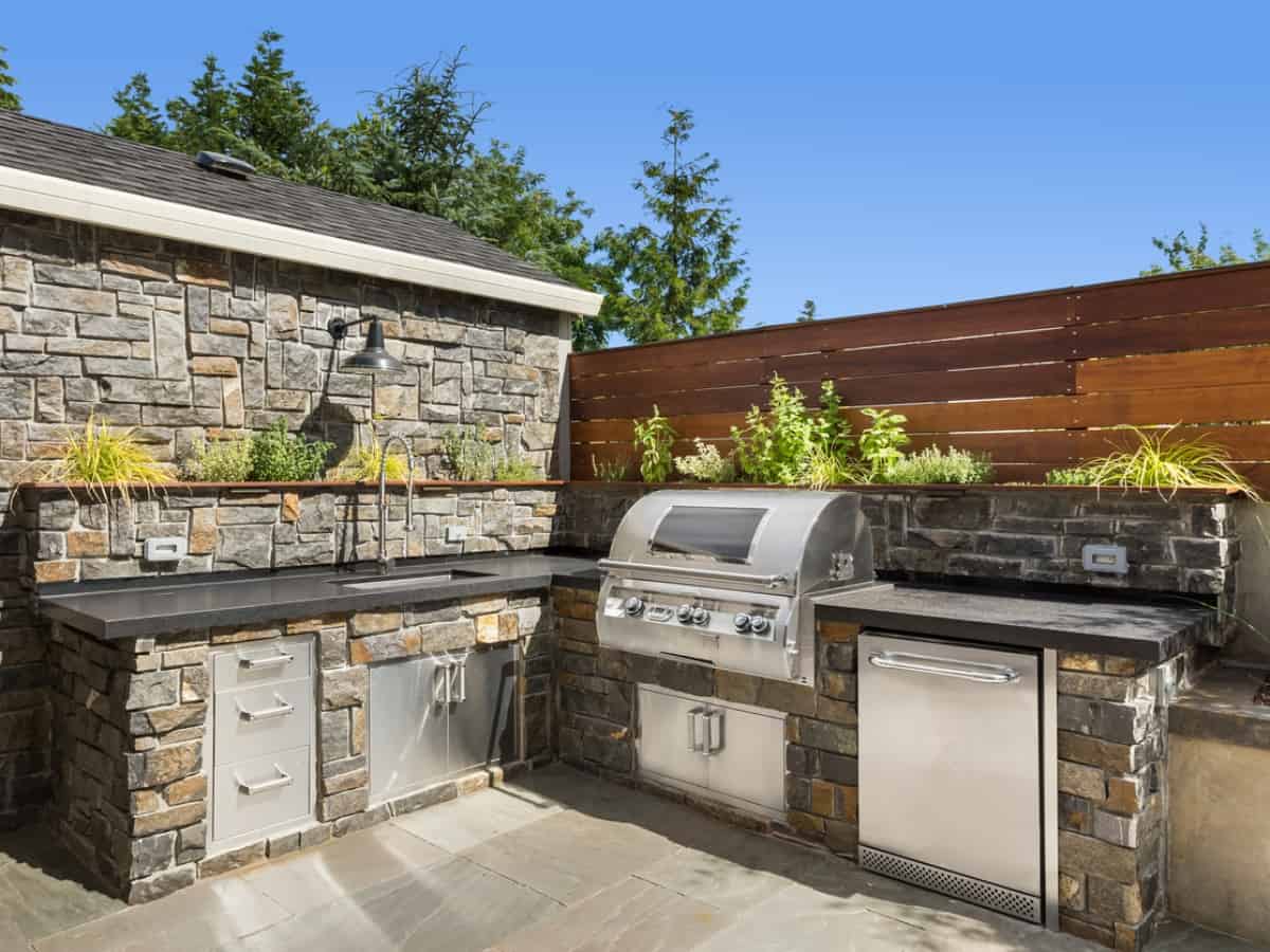 Home exterior backyard hardscape outdoor entertainment and cooking area with barbecue home renovation ideas 