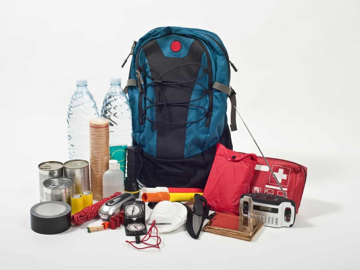 an emergency go bag for disasters, emergencies, or times when your family needs to leave home asap. includes water bottles and first aid kit