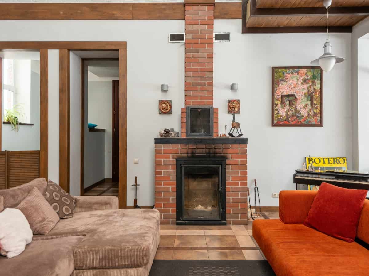 a fireplace in a living room with two couches