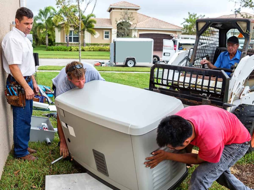 two men installing a backup home generator to a household