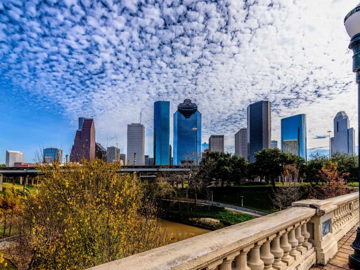 the houston skyline on a blue cloudy day