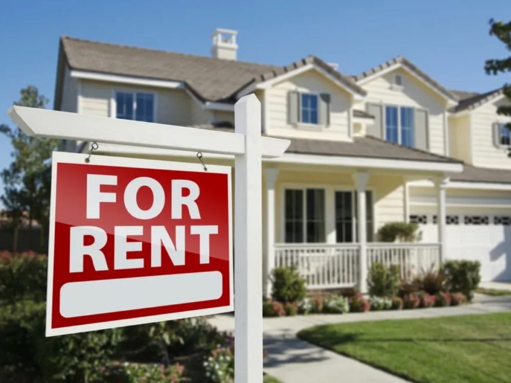 a for rent sign in from of a rental property owned by a landlord