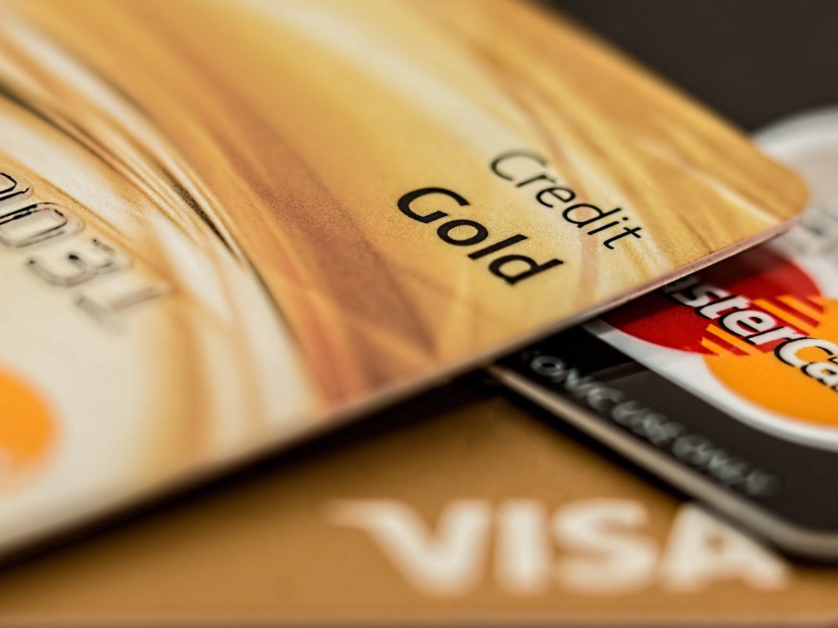 a closeup image of a credit card (visa and mastercard) which are used to build credit scores