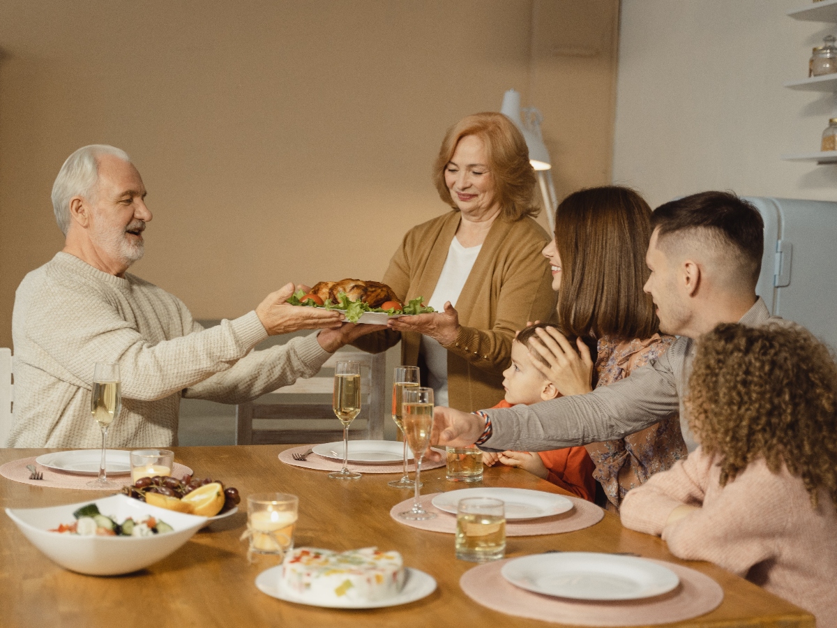 a family gathered around a table for thanksgiving