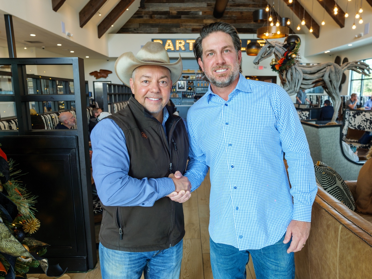 ONIT Home CEO Curtis Kindred and Marty Bryan, owner of Marty B's standing together at Marty B's Coffee Company