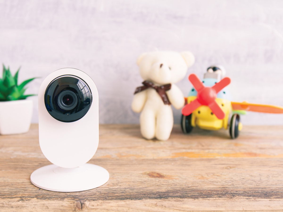 an indoor security camera on top of a dresser