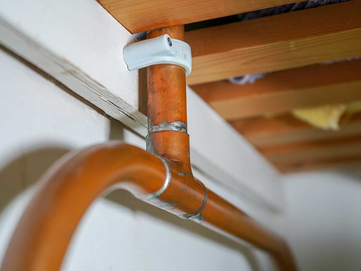 copper pipes in a home that delivers water through the home