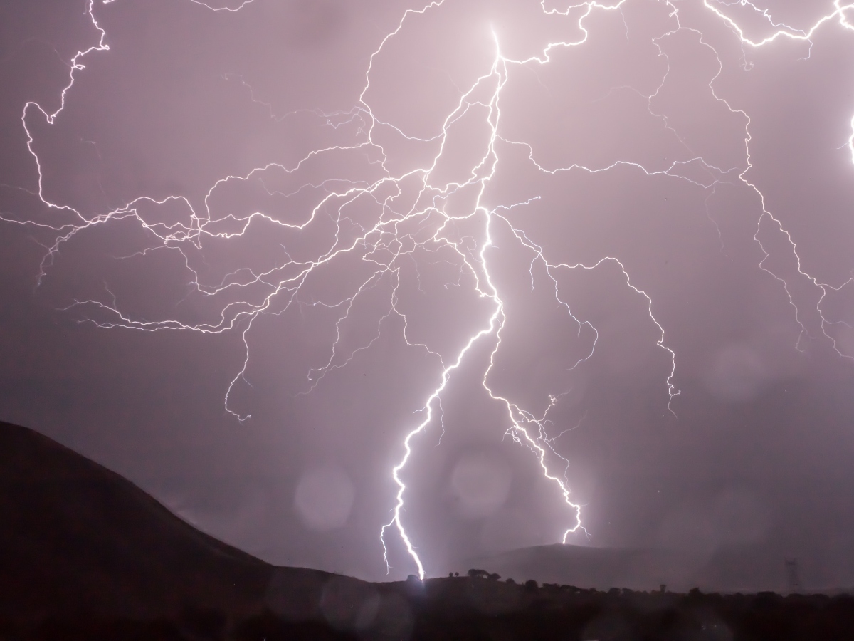 a lot of lightning in a sky during a storm