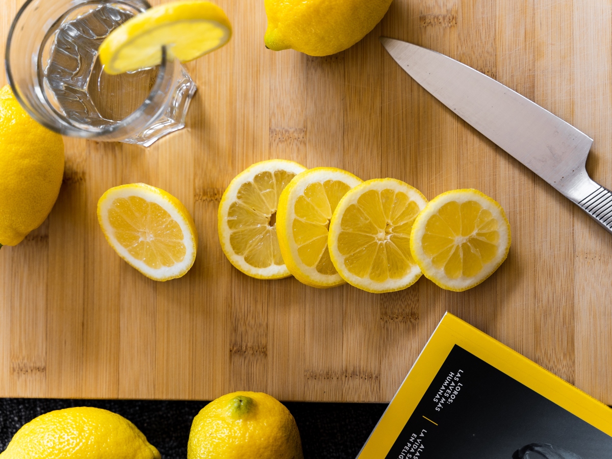 sliced lemons on a cutting board for fruit infused water to make water taste better