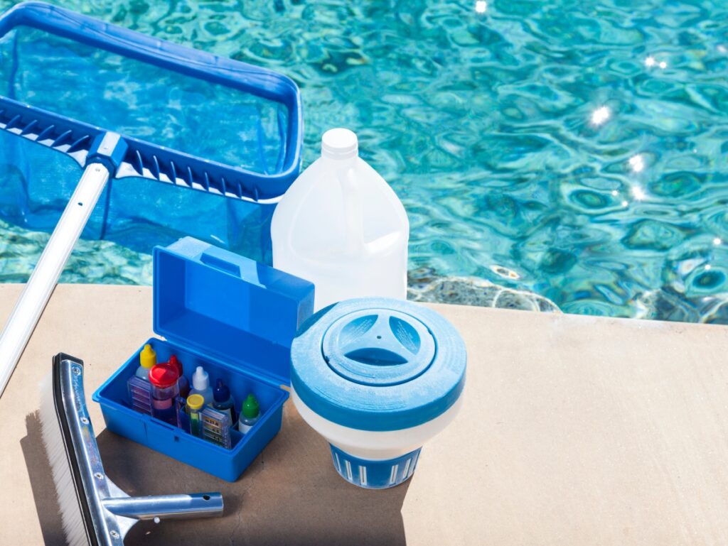 a pool maintenance kit including chlorine, a pool rake and more