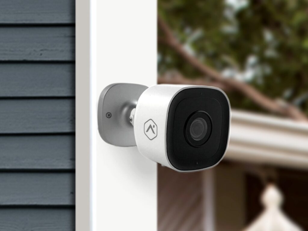 an outdoor security camera against the wall