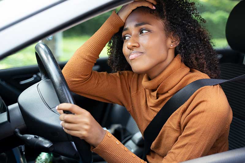 concerned woman driving