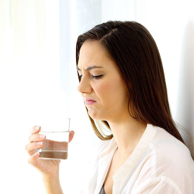 woman with bad tasting water