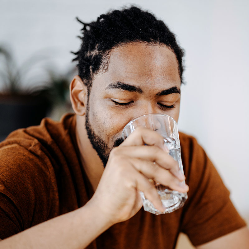 man drinking water