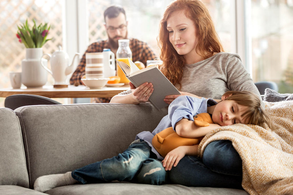 Son lying on mother's lap